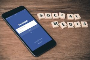 A phone with a Facebook login page has become natural to see, thus the importance of social media as a digital marketing term movers should carefully consider.