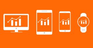 Various mobile devices with charts and analytics on them.