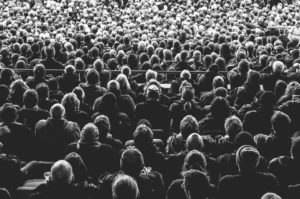Large audience of people sitting - your high-conversion About Us page should focus on them and their thoughts.