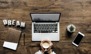 Coffee, laptop, smart phone, notebook and a dream - all it takes for a good ranking of your pages.