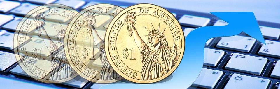 Coins above keyboard with blue arrow pointing around them.