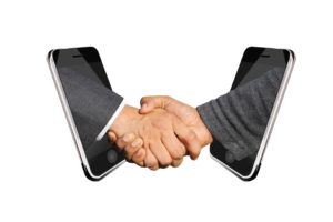 A handshake makes moving services lead to sales.