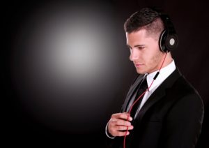 Businessman with headset, listening.