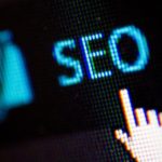 Icon of a hand pointing to SEO checkmark in WordPress.
