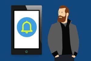 A drawing of a push notification on a mobile phone with a man standing next to it. 