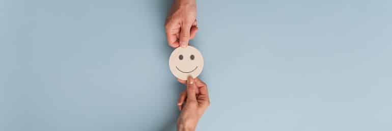 People exchanging a smiley face
