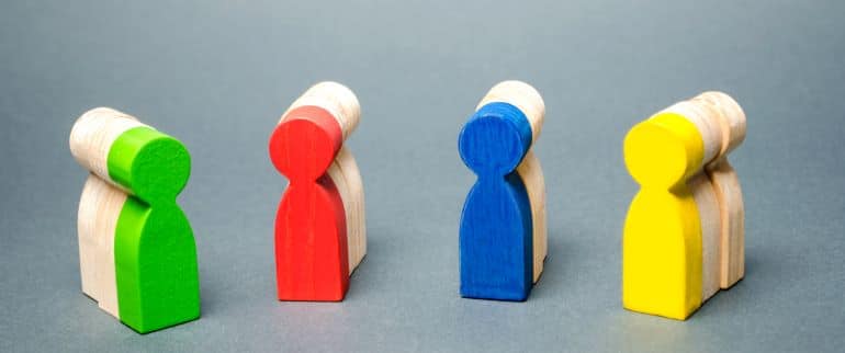 Differently colored pawns - green, red, blue, yellow.