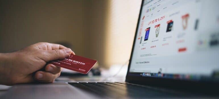 Person making a purchase online after being converted by conscious marketing.