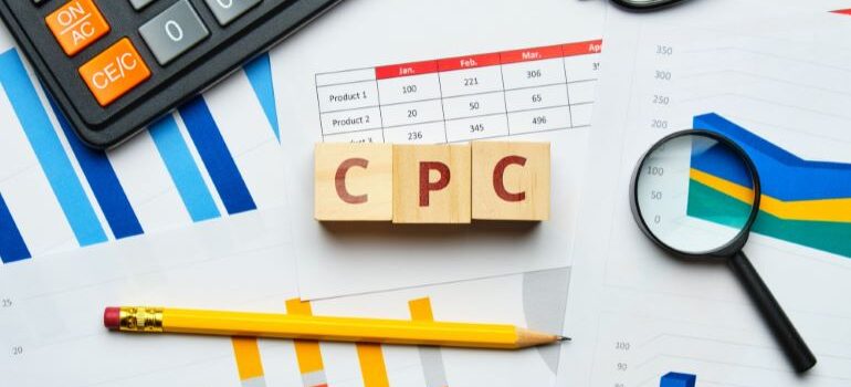 Three wooden dice that spell CPC.
