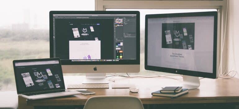 Multiple computer screens.