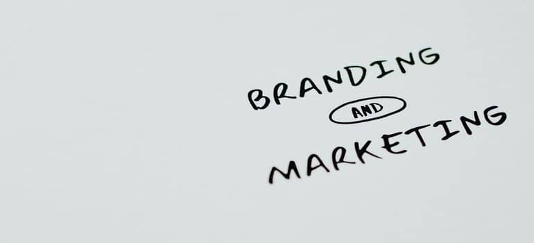"Branding and marketing" written on white paper. 