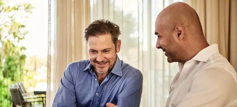 Two guys discussing a business proposal.