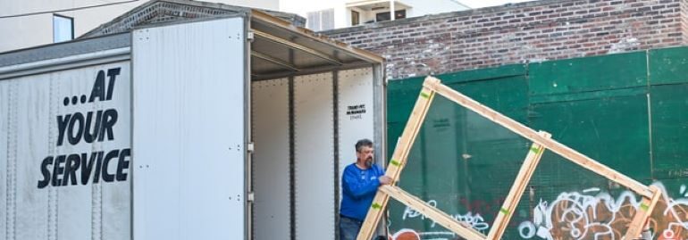 Movers loading moving van