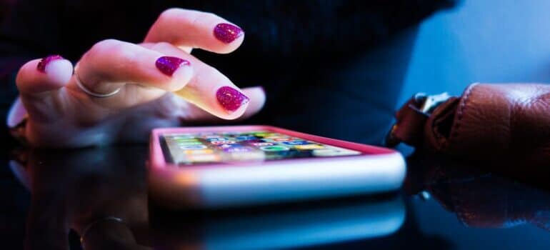 A person using their phone to type