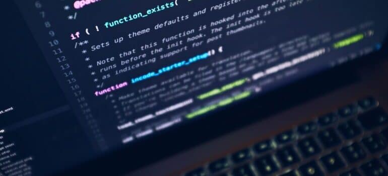 A command line is displayed on a laptop screen.