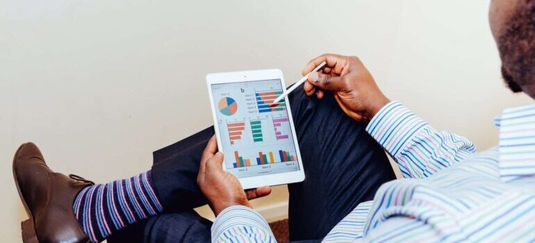 An SEO professional analyzing website data on his tablet.