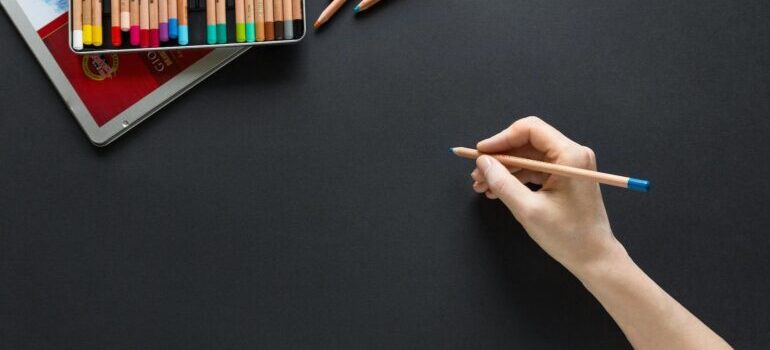 A person preparing to sketch a display ad.