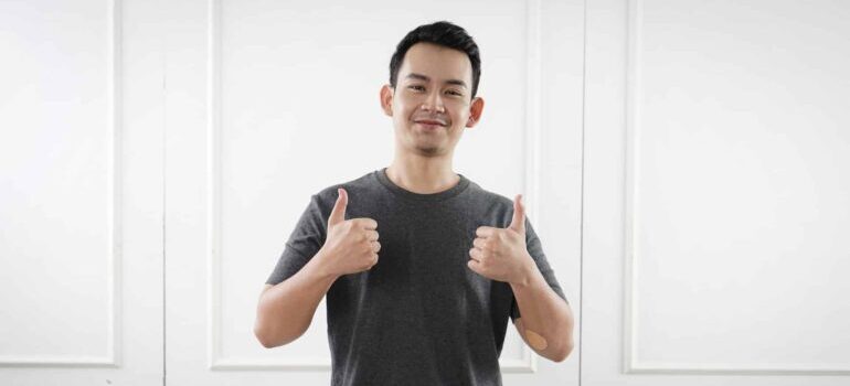 A happy customer gives a thumbs up.