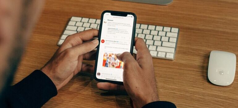A person reading an updated blog on his mobile device