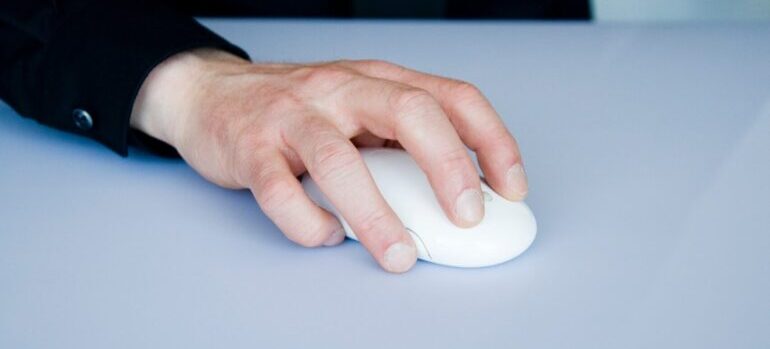 A person with a computer mouse doing A/B testing..