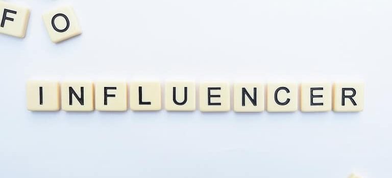 Influencer spelled out in letter blocks