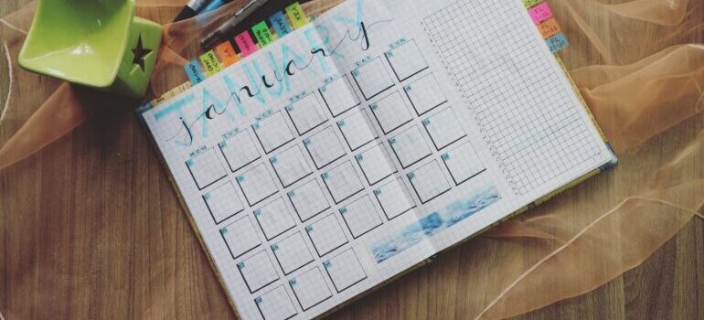 A notebook with an open planner.