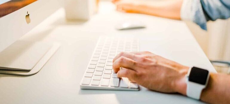 A person typing on a keyboard search for role of website audits in local SEO