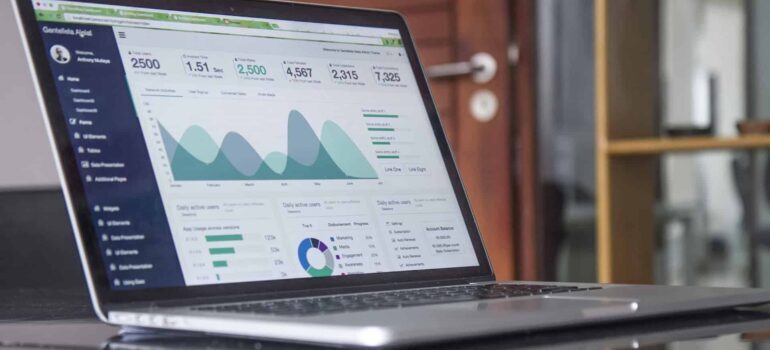 A laptop with website traffic statistics displayed.