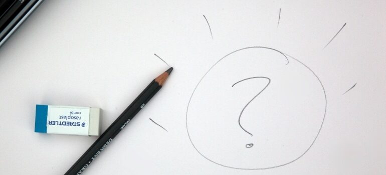 A question mark scribbled on a piece of paper