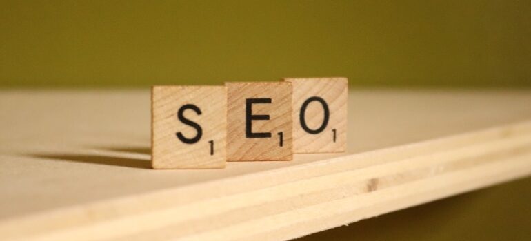 A sign showing the acronym ''SEO'', which is a vital component of Google Posts that you'll need to take advantage of when trying to use a Google Business Profile to get more customers.