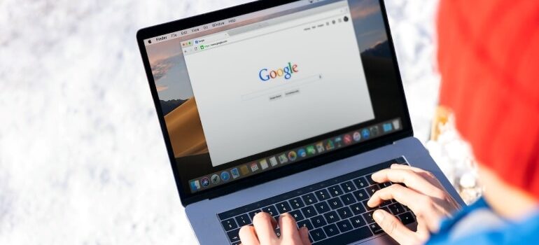 A person typing something into Google search