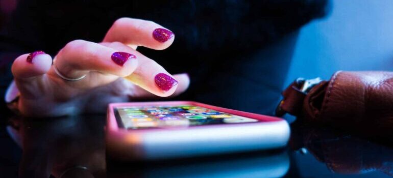 A person is scrolling through their phone.