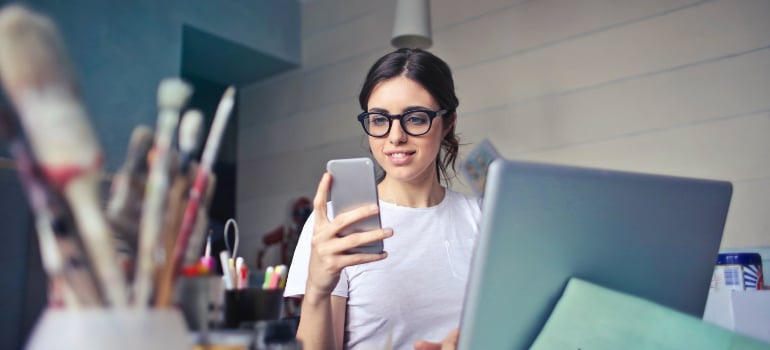 A person checks their email on a phone