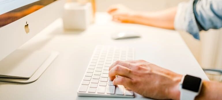 A person typing on a keyboard