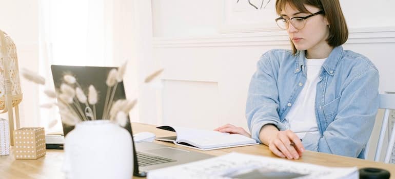 woman responding to a review and taking notes