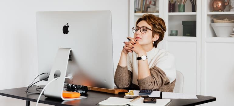 A woman reading emails on her computer