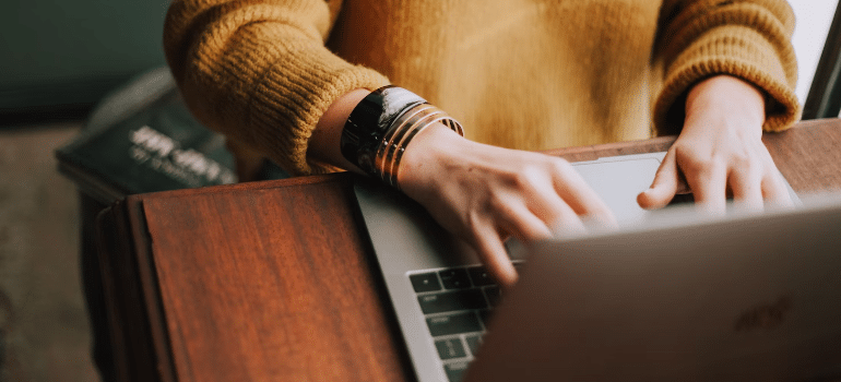 A person researching how to modernize your moving company's website