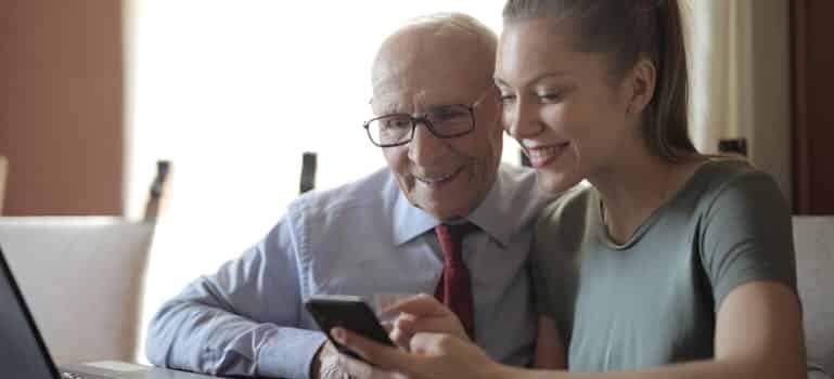a grandfather talking about business with his granddaughter