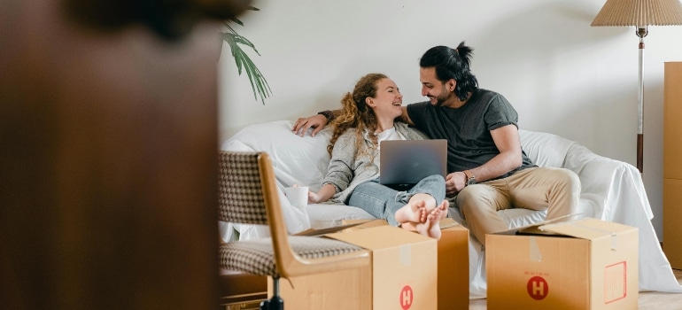 couple reading how to boost business with summer moving offers