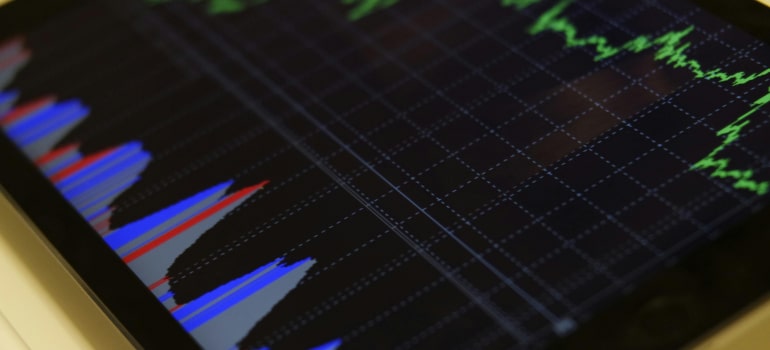 A digital graph on a screen showing colorful data trends and metrics, illustrating the importance of measuring and analyzing marketing ROI to determine how much should moving companies invest in marketing.