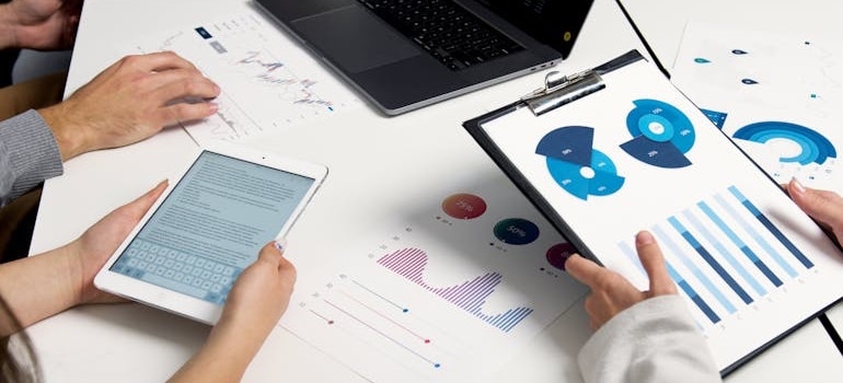 Colleagues using analytical tools to measure their marketing success