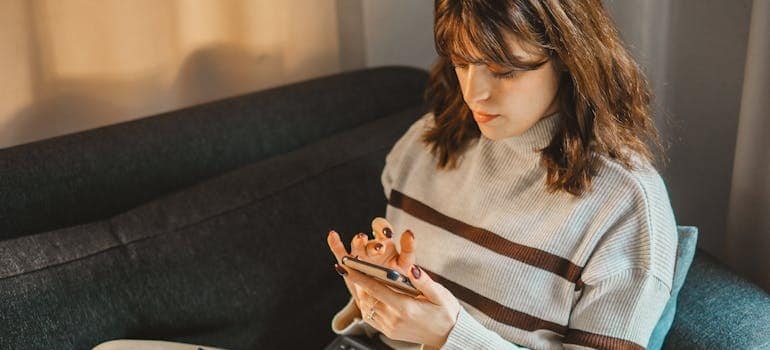 A person using their smartphone to read about SEO shifts and storage company strategies