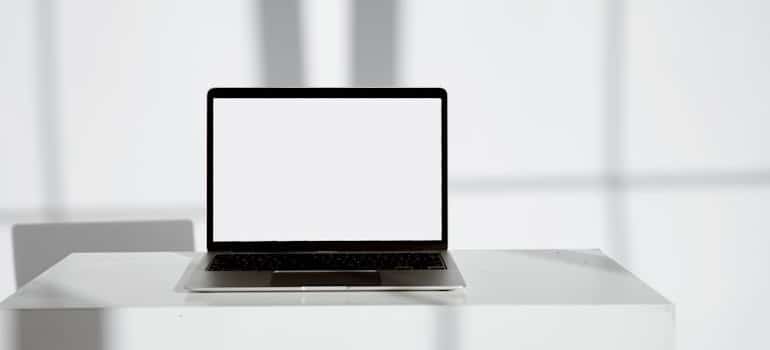 A laptop on a white table