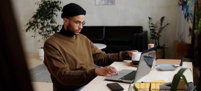 A person reading about top SEO trends for movers in 2025