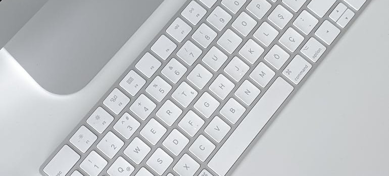 A white keyboard on a white table
