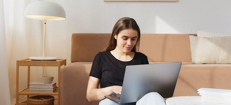 A person working on a laptop, analyzing what AI knows about your moving business