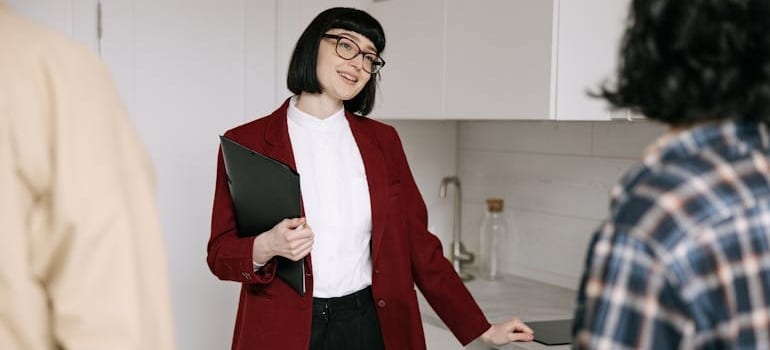 A real estate agent talking to potential cusomers