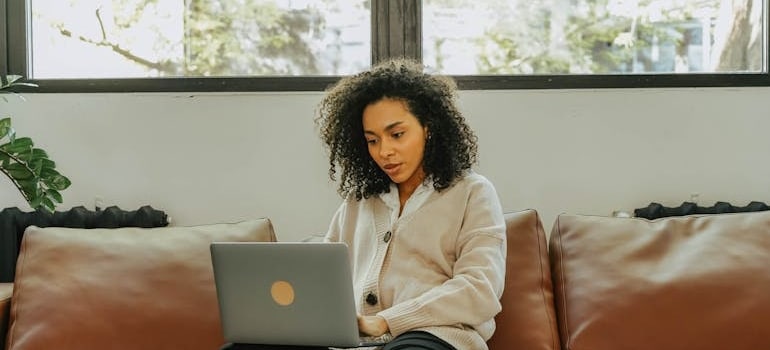 A person using a laptop to read about Google's algorithm changes in 2025