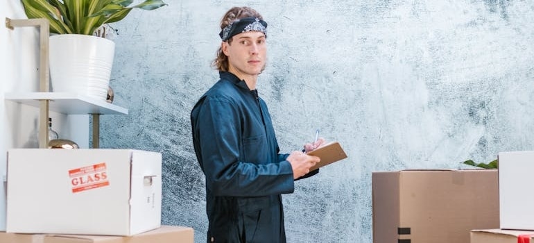 A moving professional holding a clipboard after learning what AI knows about your moving business and how to use it