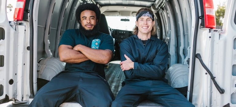 Employees of a moving company that keeps track of Canadian home prices and moving demand and makes appropriate adjustments
